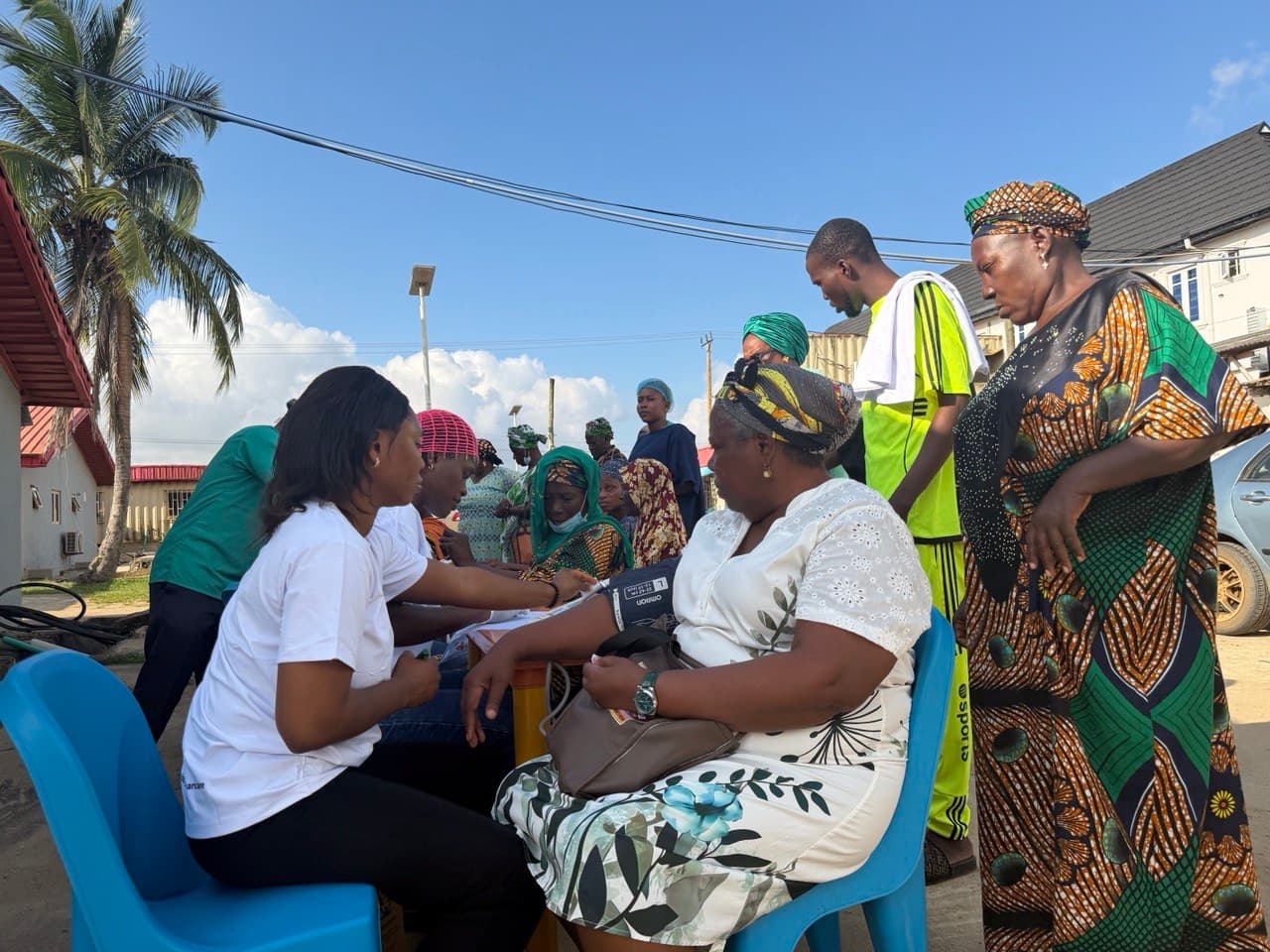 Community members collecting relief and support supplies outdoors