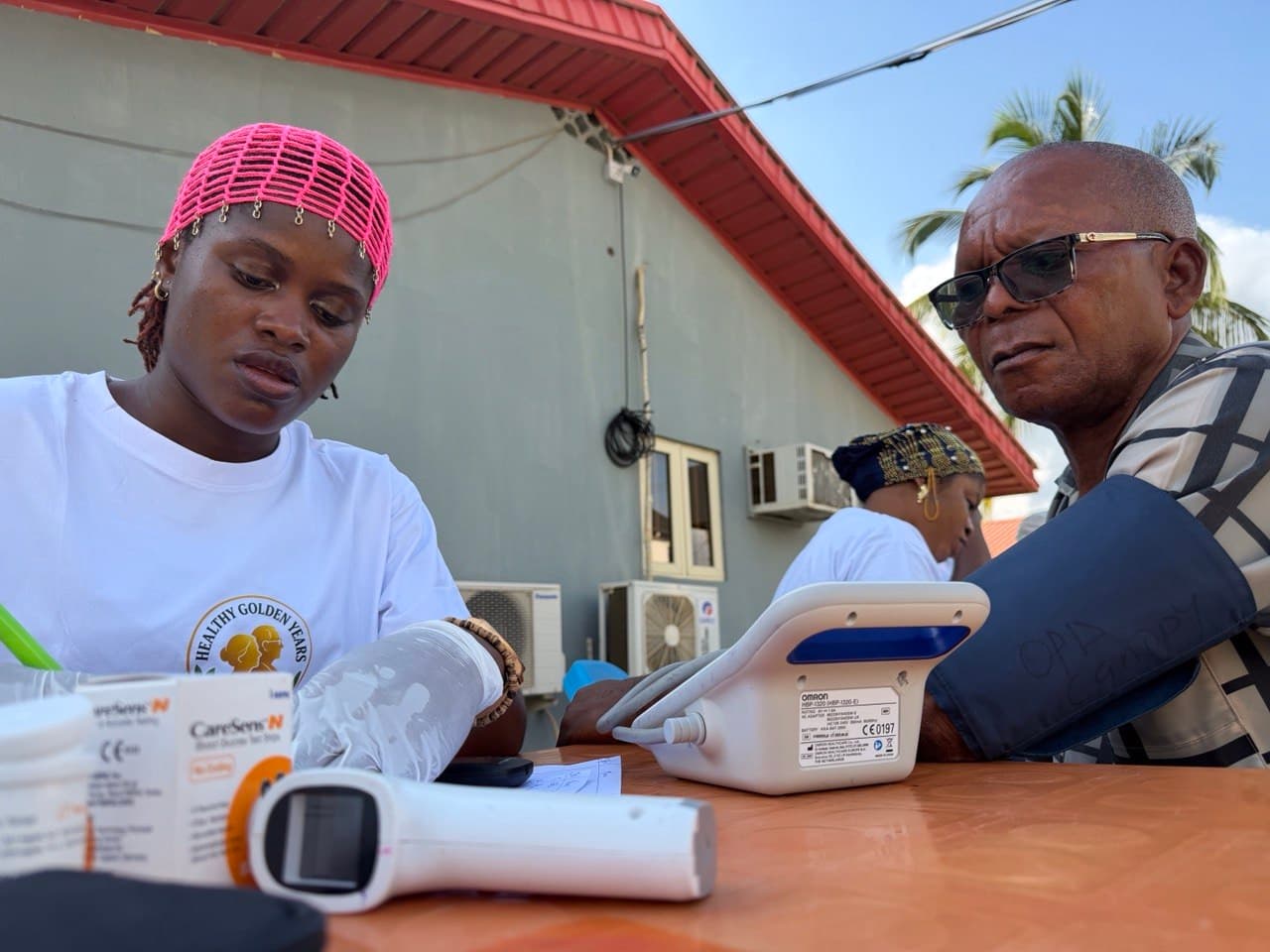 A community health outreach event with older adults and volunteers